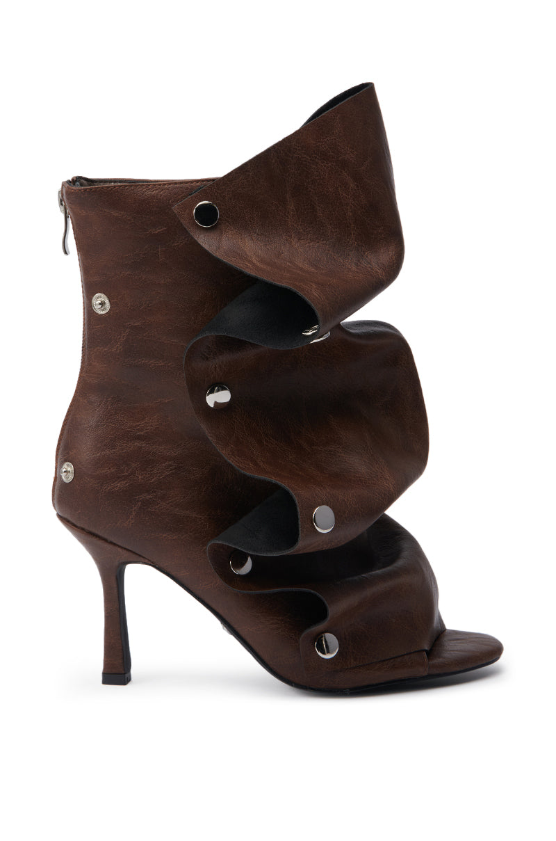The AZALEA WANG BIRD SONG Brown Snap Detail Open Toe Bootie features layered faux leather, silver snap accents, a stiletto heel, and a back zipper for easy wear.