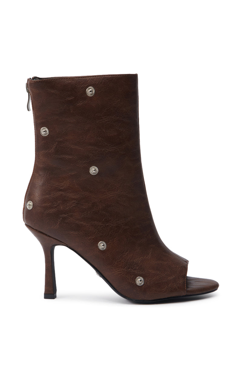 The AZALEA WANG BIRD SONG BROWN SNAP DETAIL OPEN TOE BOOTIE features a stiletto heel, almond peep toe, side zipper, and small round silver snaps on brown faux leather.