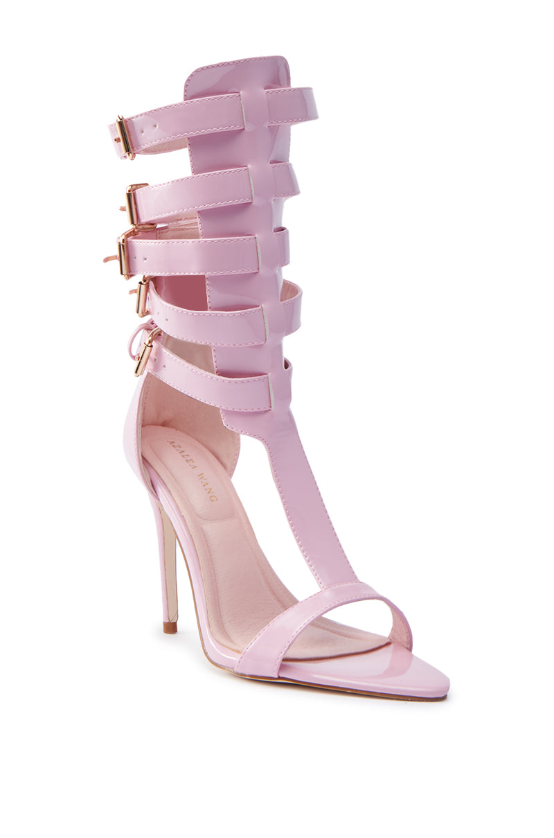The AZALEA WANG CHERELL Pink Gladiator Sandal Stiletto features faux leather with multiple ankle straps, gold buckles, an open toe, and a sleek stiletto heel for a bold statement.