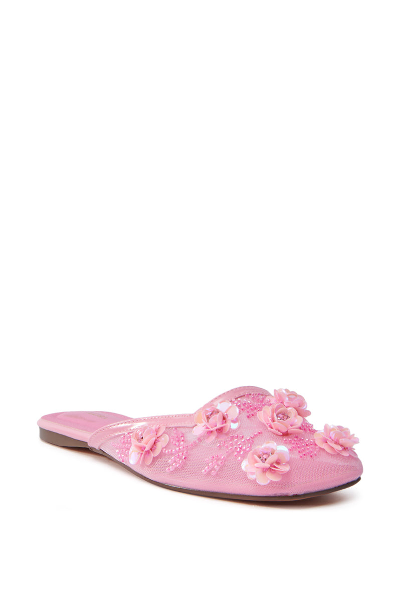 The AZALEA WANG CHERINA PINK FLAT WITH EMBELLISHMENT is an elegant slip-on shoe featuring a pointed toe, open back, and delicate 3D floral embellishments with embroidered details for added texture and femininity.
