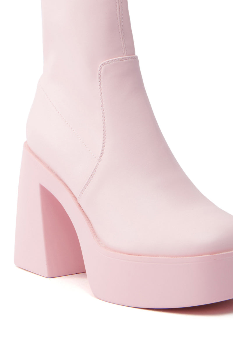 The AZALEA WANG DANIELLE BABY PINK STRETCH PU CHUNKY HEEL BOOTIE showcases a light pink high-heeled ankle boot crafted in smooth faux leather, featuring a chunky square heel and platform sole for a seamless modern style.