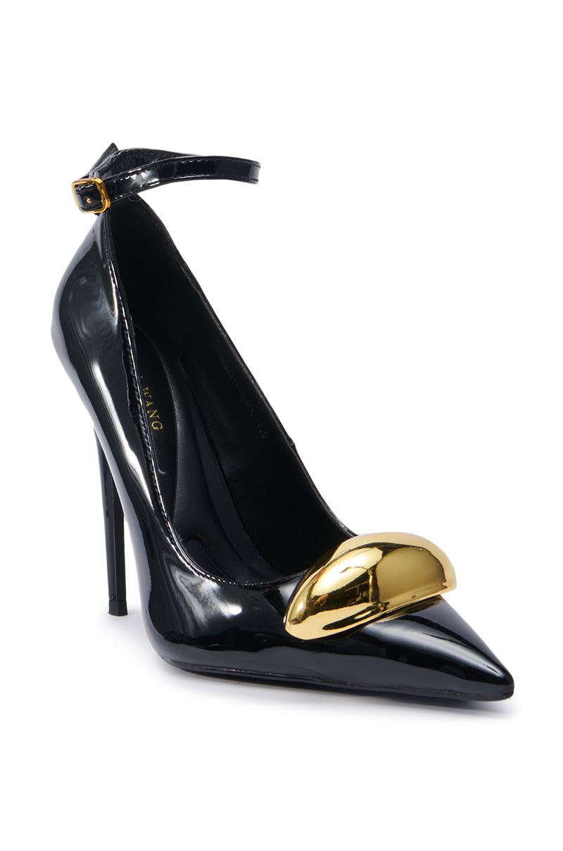 Introducing the AZALEA WANG ESMARIA BLACK STILETTO PUMP, a glossy black stiletto featuring a pointed toe and ankle strap, expertly crafted from sleek faux leather. This shoe is highlighted by a striking gold metallic accent on the toe and includes a comfort cushion insole for added ease.