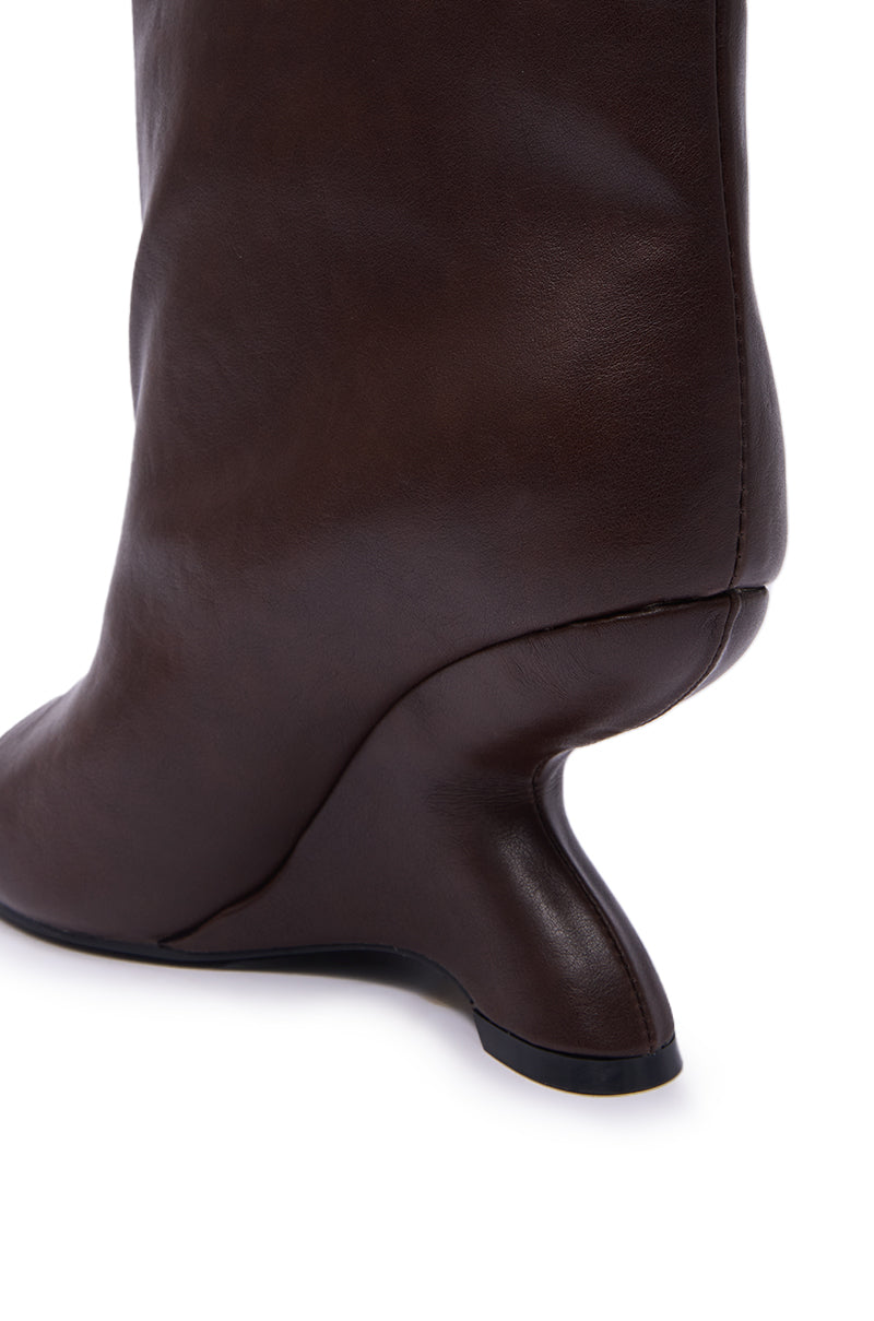 Close-up of the AZALEA WANG FAOI Brown Inverted Wedge Open-Toe Bootie, featuring dark brown faux leather with a sculpted, curved heel and smooth texture, shown against a white background.