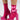A person shows off bright pink high-heeled sandals with a chunky woven texture and ankle straps, paired with AKIRA Label's BOW DOWN SOCKS featuring matching pink bows. The stretchy knit of the socks adds a cozy touch against the plain white background.