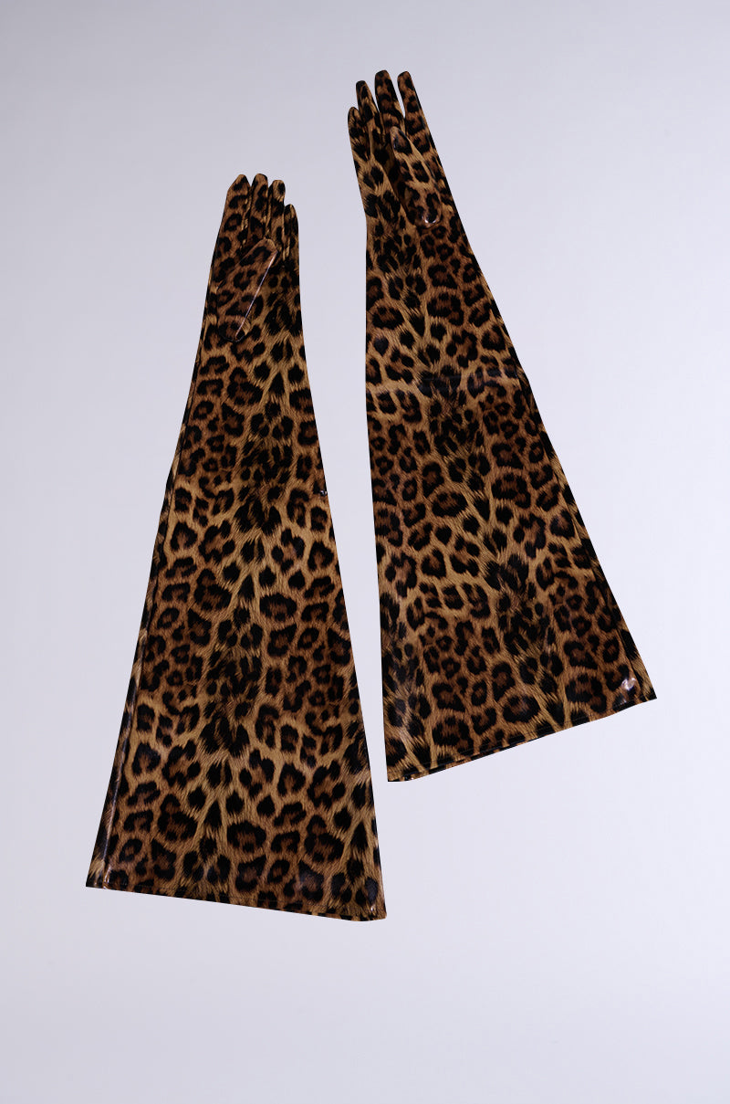 The IM STRIKING PU GLOVES are long, fitted faux leather gloves in a brown and black leopard print, displayed flat on a light solid background.