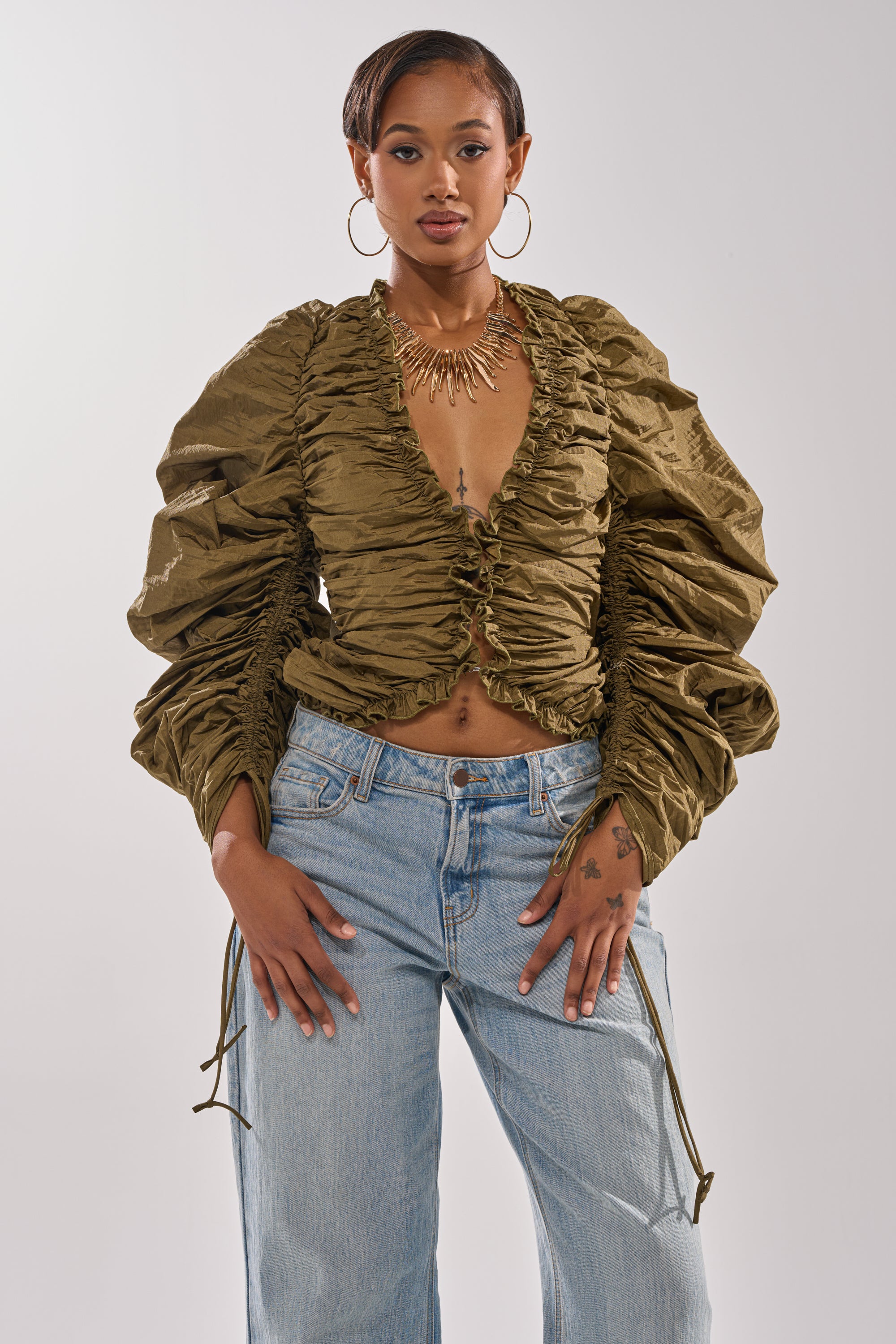 IN IT TO WIN IT RUCHED BLOUSE – AKIRA