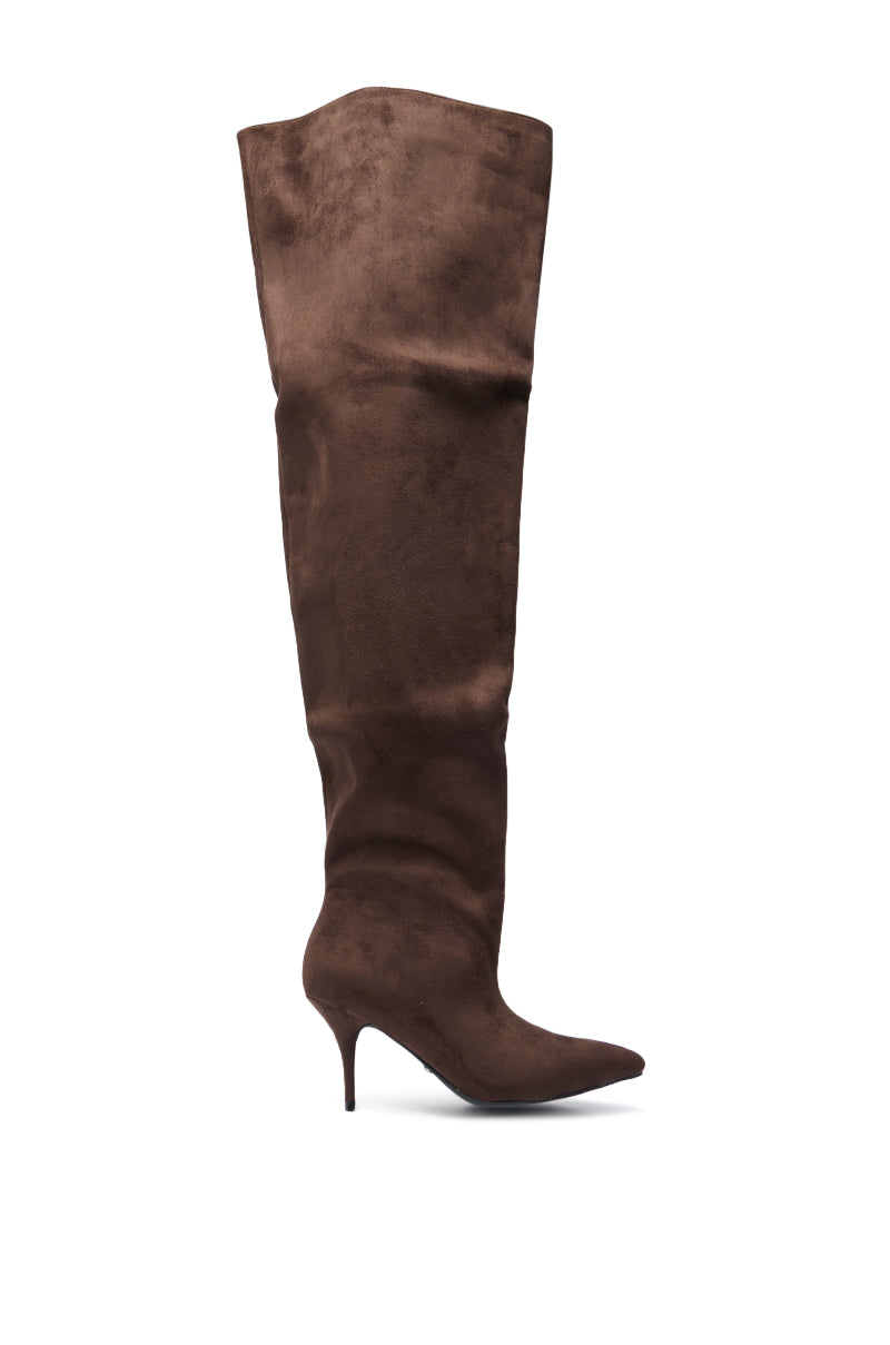 The AZALEA WANG HALINA CHOCOLATE THIGH HIGH BOOT is a brown faux suede, pointed toe thigh-high boot with a stiletto heel, pictured in profile against a white background.