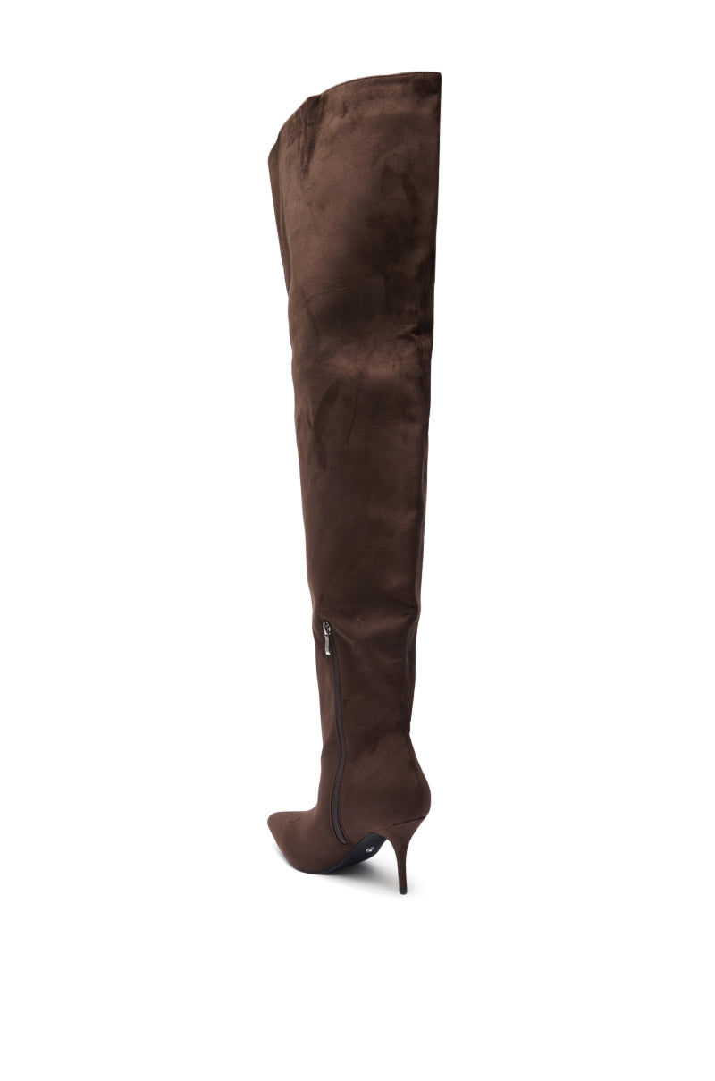 The AZALEA WANG HALINA CHOCOLATE THIGH HIGH BOOT, a brown faux suede, pointed toe boot with a side zipper and stiletto heel, is shown against a white background.