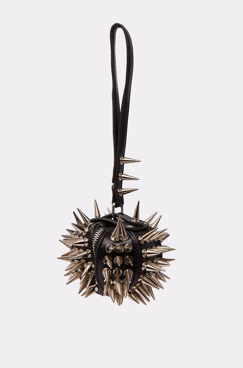The IM SHARP MINI BAG is a small black faux leather handbag with a wrist strap, featuring bold silver spikes and metal studs for a striking punk-inspired look.