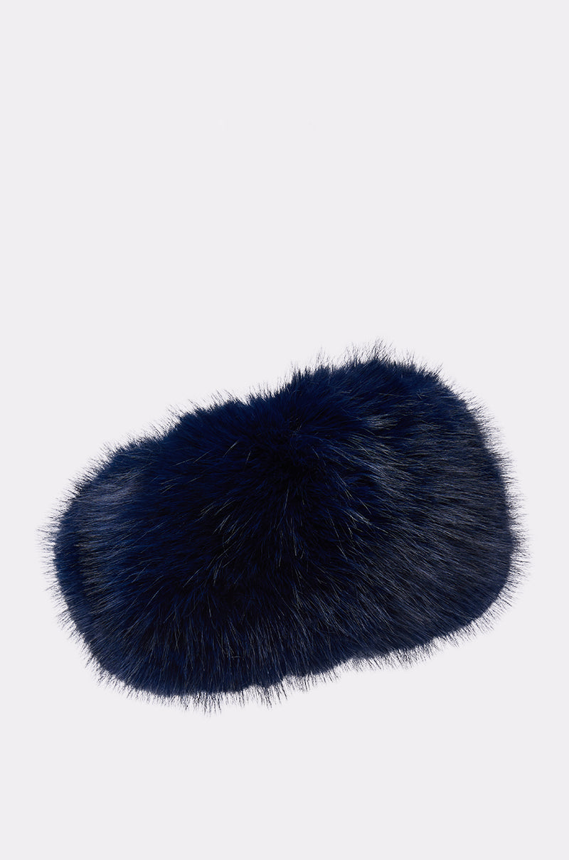 The SO CHIC FAUX FUR HEADBAND in dark navy blue, featuring a fluffy faux fur texture, is displayed on a light gray background.