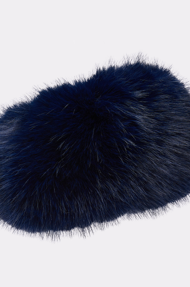 The SO CHIC FAUX FUR HEADBAND is a fluffy, oval-shaped accessory in dark navy blue faux fur, shown against a plain white background.