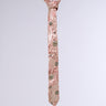 The LIVE FOR IT EMBELLISHED TIE is a pink necktie with intricate embroidery and shimmering metallic jewels in a brocade pattern, featuring textured floral and circular motifs on a plain background.