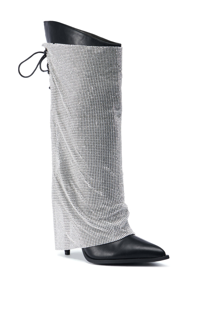 The AZALEA WANG JACLYN EMBELLISHED STILETTO BOOT IN BLACK is a chic stiletto boot with a pointed toe, adorned with a stunning rhinestone mesh overlay on black leather, and features an elegant lace-up detail at the top.