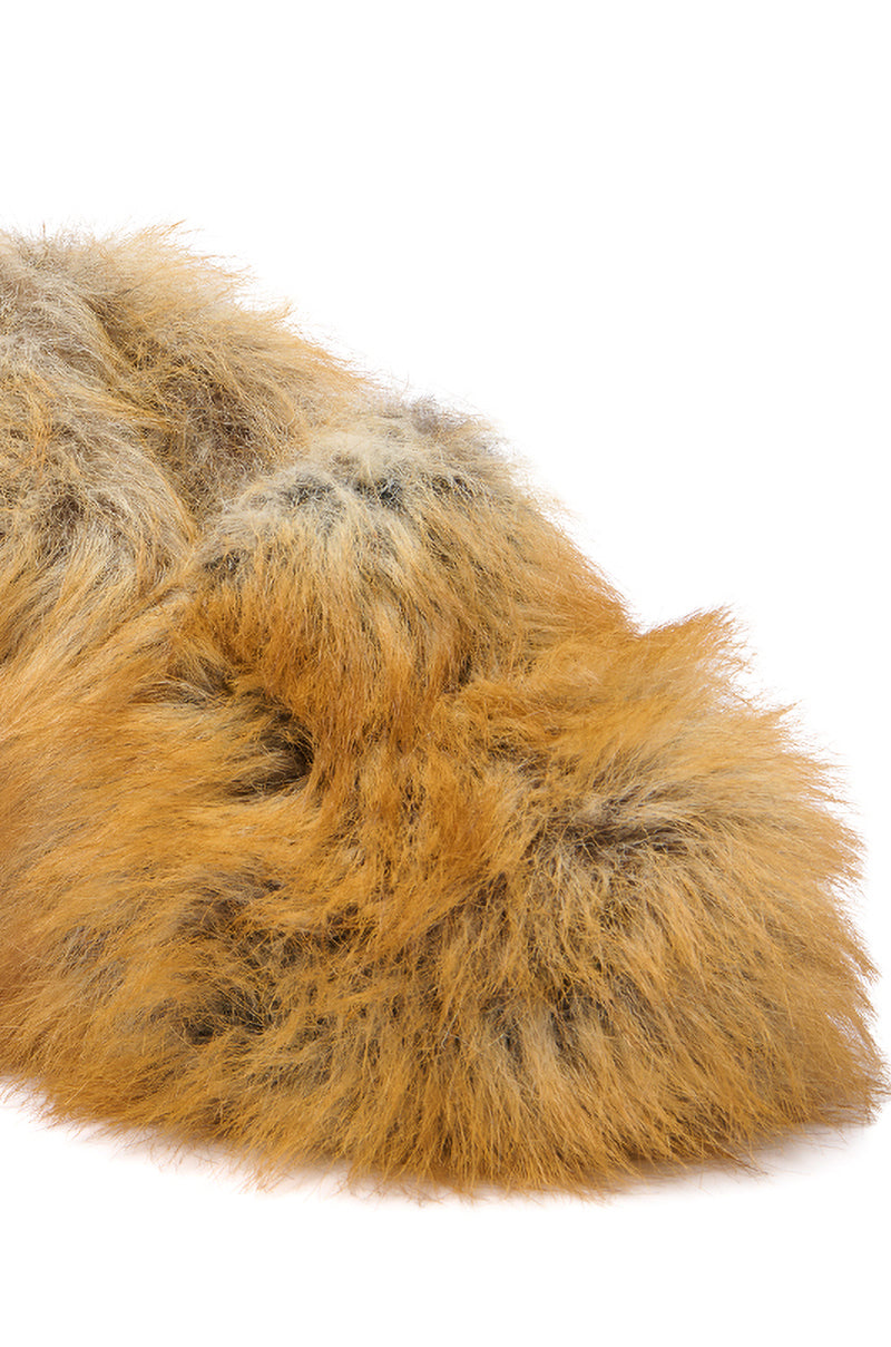 A close-up of the fluffy orange and black faux fur on the AZALEA WANG JAEKE FOX FUR WEDGE PUMP IN BROWN, set against a white background.