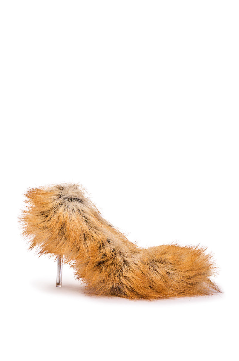 The AZALEA WANG JAMEECK TAN FUR PUMP, an orange and brown faux fur shoe with a pointed toe and thin transparent stiletto heel, is displayed against a white background.