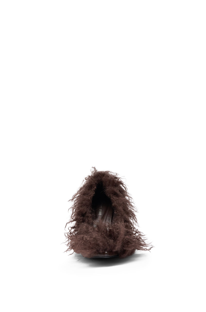 A front view of the AZALEA WANG JAMEEKA CHOCOLATE POODLE HAIR PUMP, featuring a fluffy, shaggy texture and pointed toe, photographed against a white background.