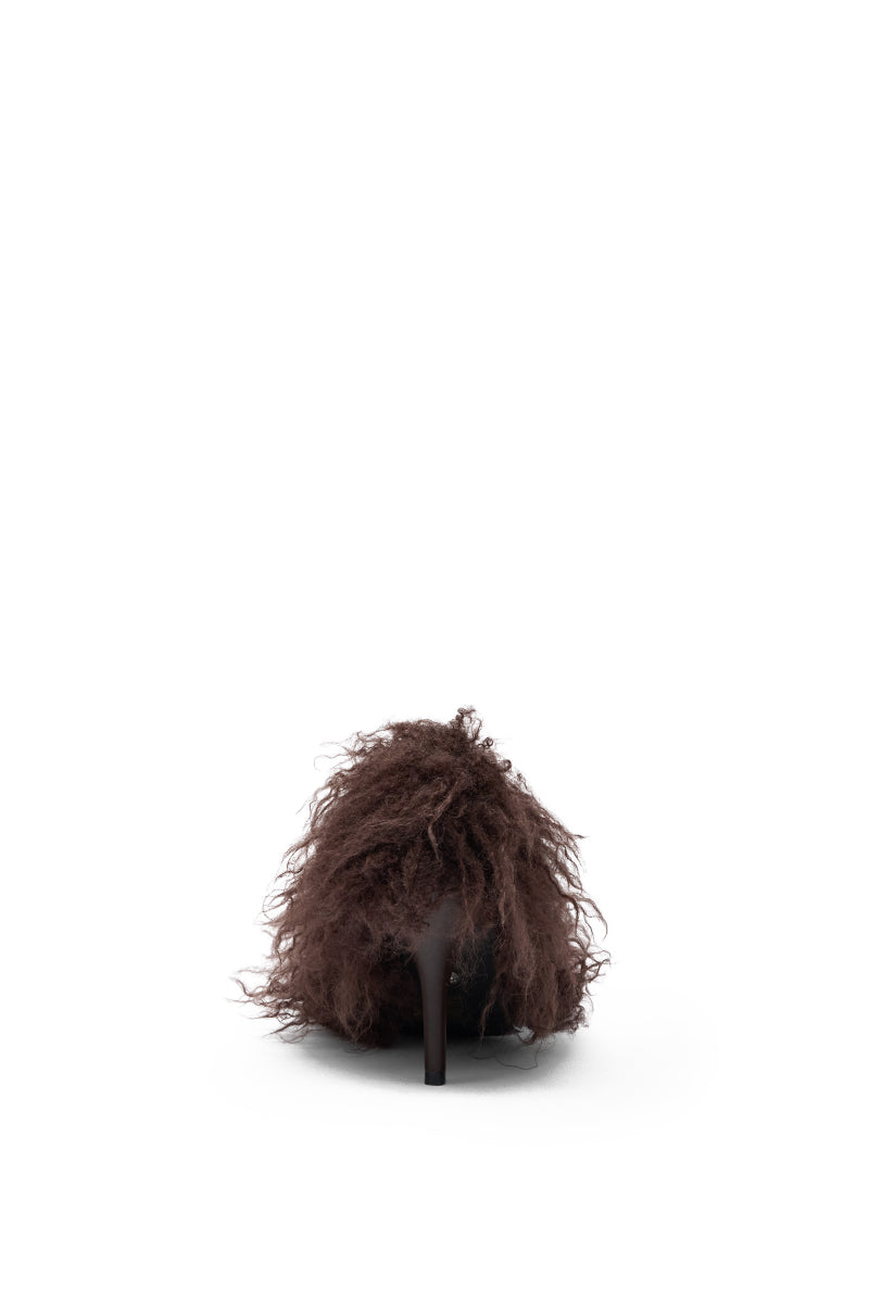 The AZALEA WANG JAMEEKA CHOCOLATE POODLE HAIR PUMP is a single brown stiletto heel with a fluffy, shaggy-textured upper, displayed from the back against a plain white background.