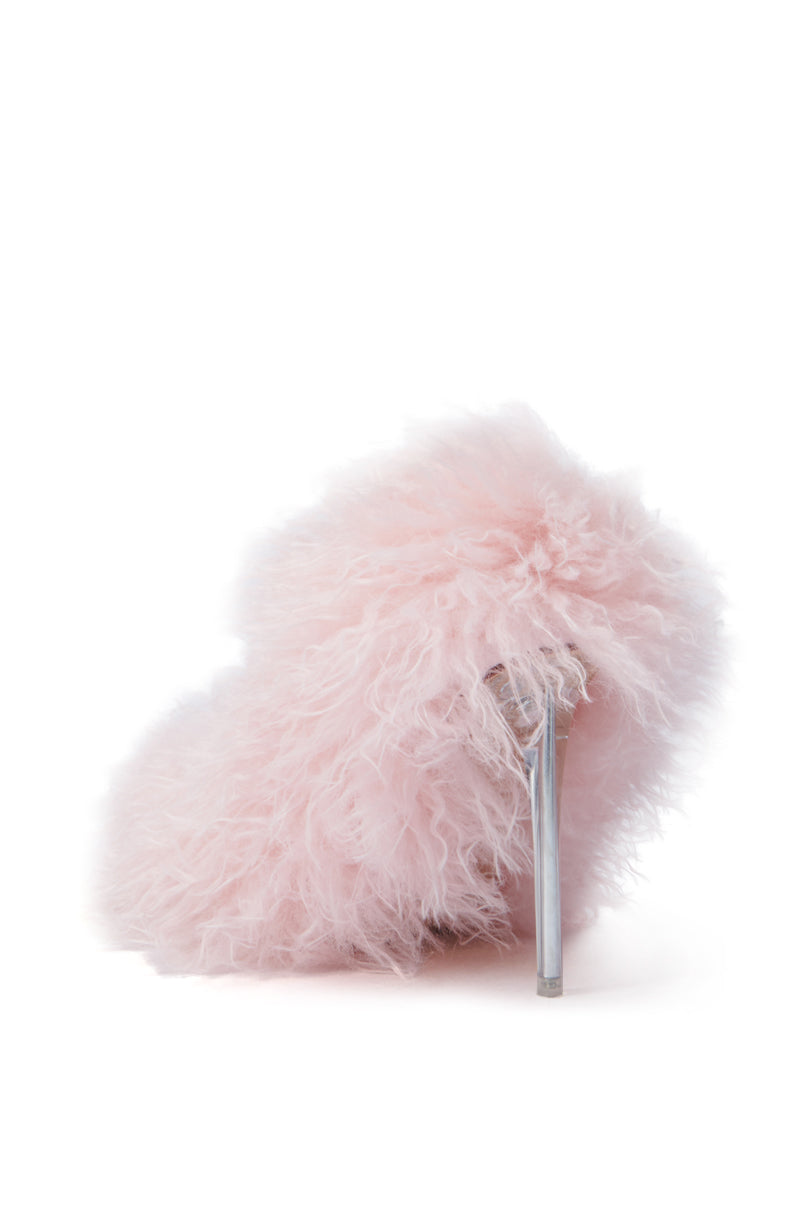The AZALEA WANG JAMEELA PINK FUR STILETTO PUMP stands out on a white background, featuring a translucent stiletto heel and a soft faux fur texture. This elegant stiletto combines style with a comfort cushion insole, offering both glamour and comfort.