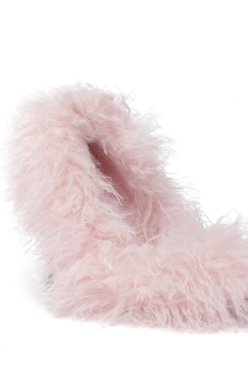 Close-up of the AZALEA WANG JAMEELA PINK FUR STILETTO PUMP, showcasing its fluffy, pastel pink exterior with a soft, feathery texture. The fuzzy fabric resembles faux fur, exuding warmth and comfort. The plain white background accentuates the pump's vibrant color and inviting texture.
