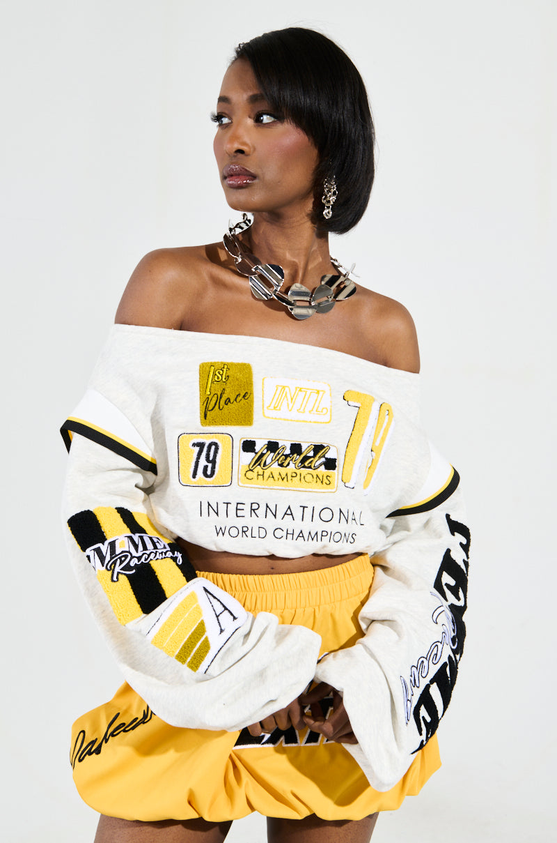 RACING THROUGH OFF THE SHOULDER SWEATSHIRT – AKIRA