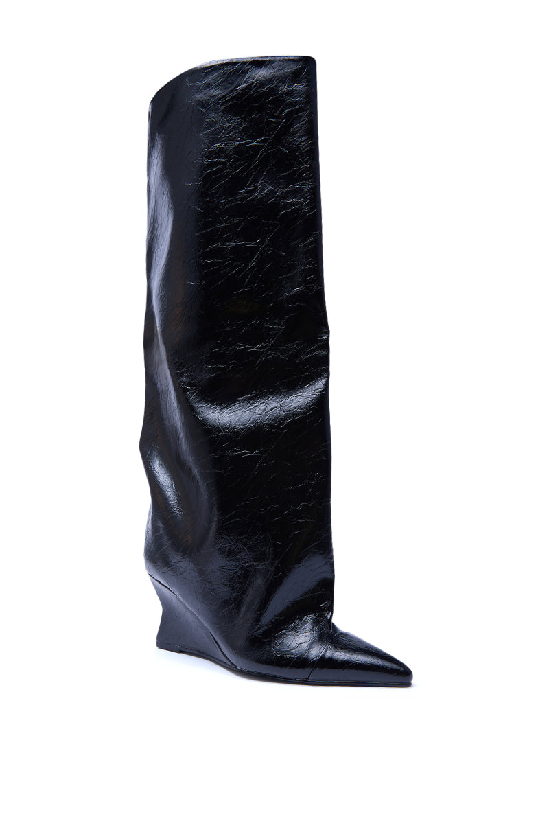 The AZALEA WANG KENYA BLACK KNEE HIGH WEDGE BOOT is a single tall black faux leather boot with a pointed toe, shiny slightly slouchy texture, and wedge heel, shown against a white background.