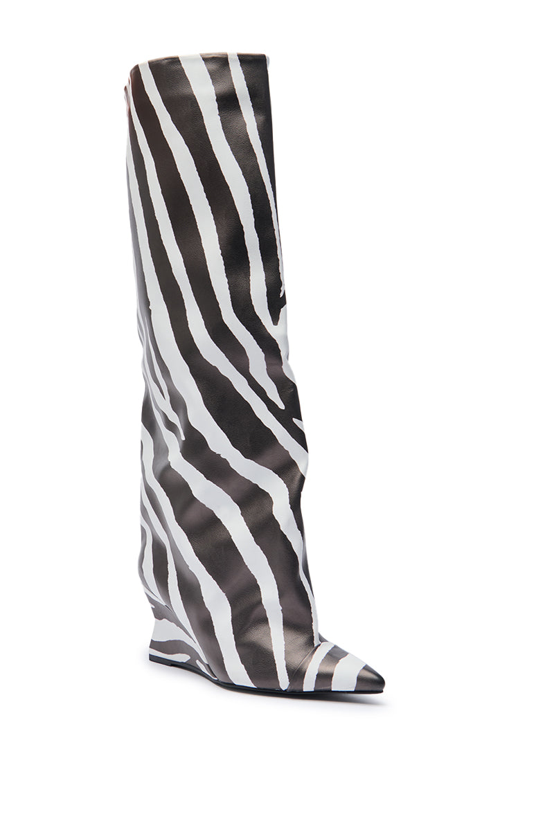 The AZALEA WANG KENYA ZEBRA KNEE HIGH WEDGE BOOT features a black and white stripe pattern, pointed toe, loose slouchy fit, and is crafted in faux leather.