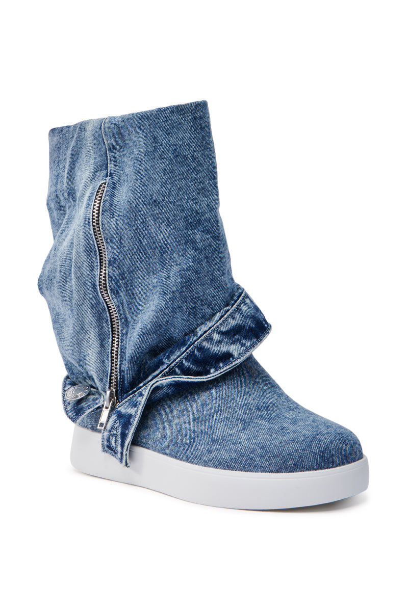 The AZALEA WANG KIMIKA DENIM BOOTIE is a slouchy design denim sneaker bootie with side zipper detailing, a white sole, and an almond toe.