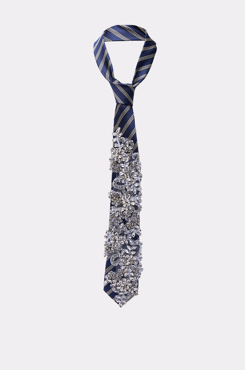 NOT YOUR TYPICAL TIE: A navy and yellow striped tie with clusters of sparkling silver rhinestones and beads on the lower half—a bold business accessory—shown on a plain white background.
