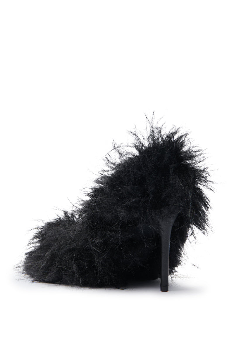 The AZALEA WANG KURT BLACK FUR EMBELLISHED PUMP is a high-heeled stiletto covered in black faux fur, displayed on a plain white background.