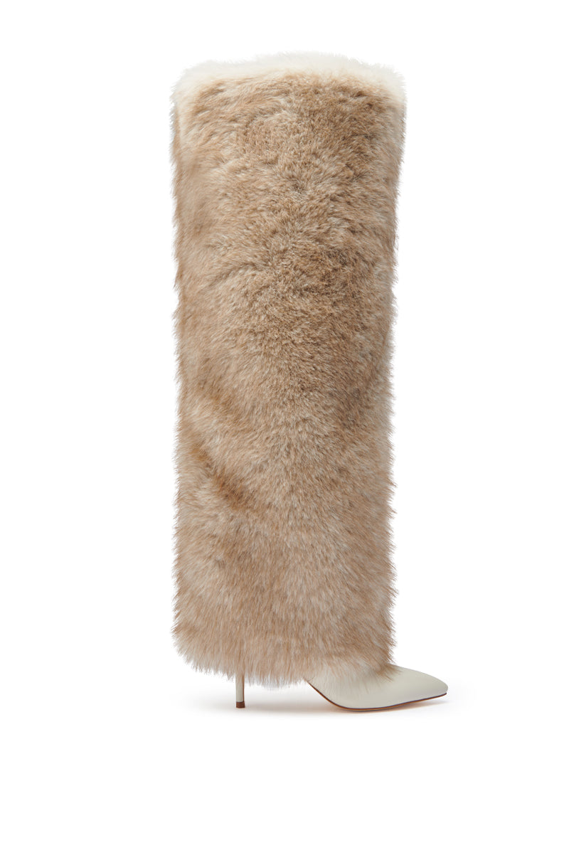 The AZALEA WANG LAGANN BONE THIGH HIGH FUR LUXE BOOT is a stiletto heel thigh-high boot covered in tan faux fur with a pointed white faux leather toe.