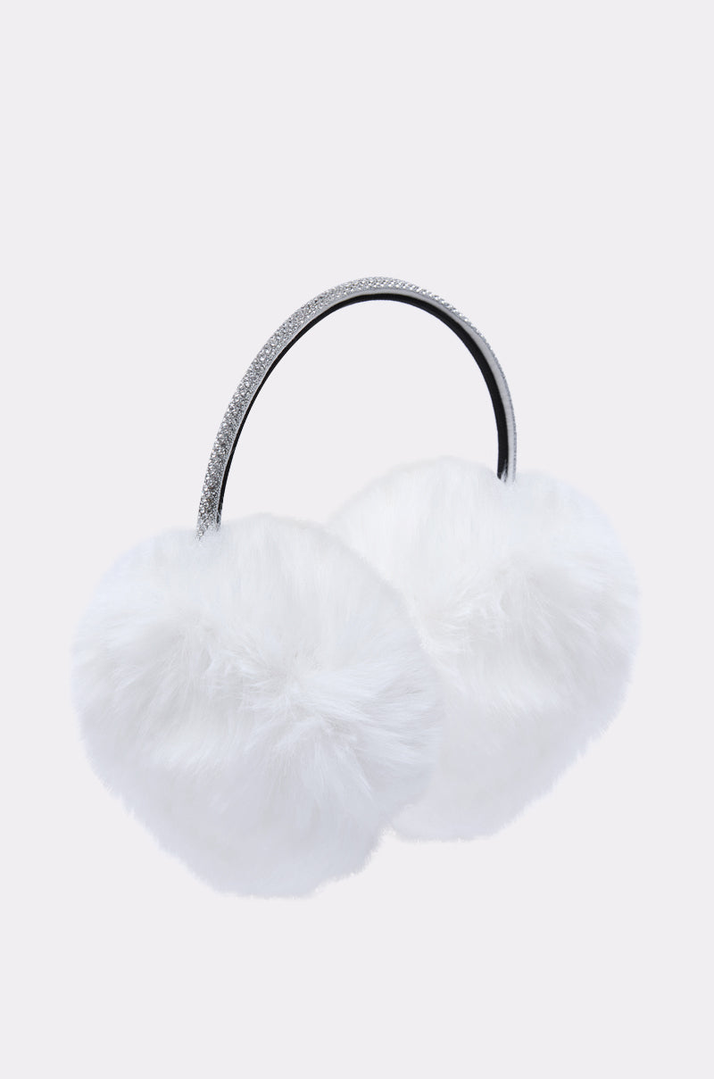 The EXTRA RHINESTONE EAR MUFFS IN WHITE feature fluffy faux fur and a sparkling rhinestone headband, making them the perfect winter accessory, showcased against a simple light background.