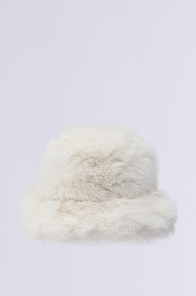 The BABY IT'S COLD OUTSIDE Faux Fur Bucket Hat in ivory, part of the AKIRA Label collection, is a must-have for your winter wardrobe. Against a simple white backdrop, this snug accessory seamlessly blends warmth with style.