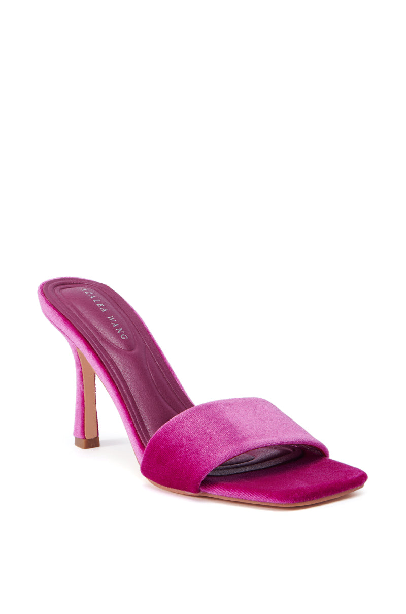 The AZALEA WANG PERSUASION FUCHSIA SANDAL boasts a lively fuchsia shade, with an open toe design and a velvet upper. It features a sleek stiletto heel and a cushioned insole for added comfort.