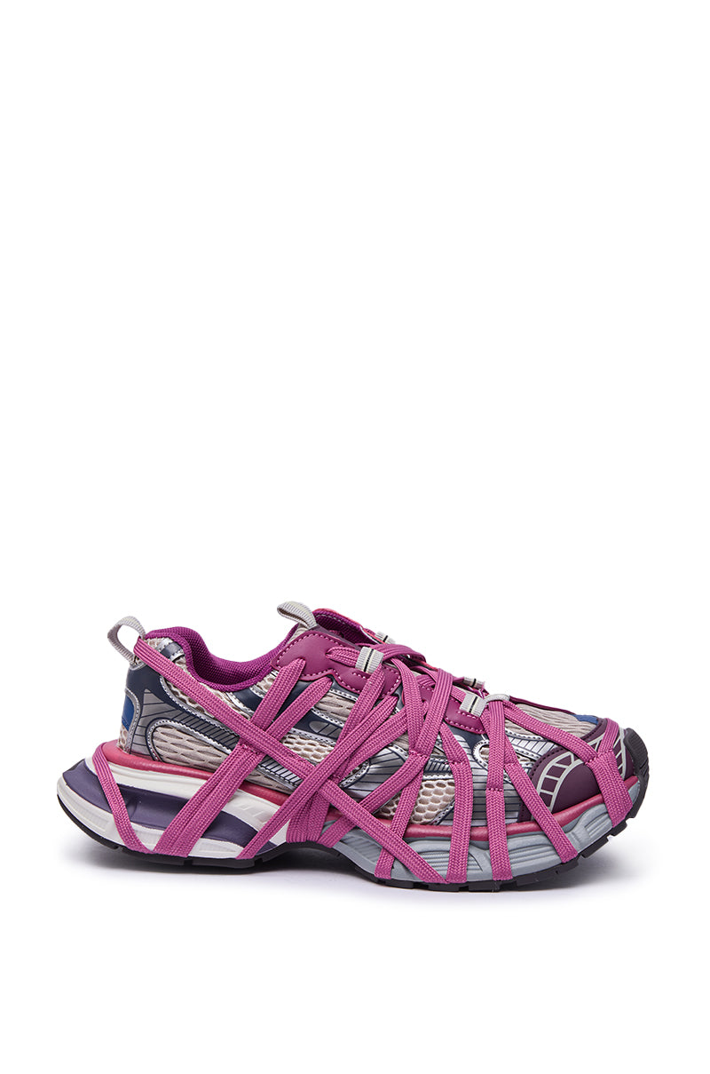 The AZALEA WANG SELIE PURPLE LACE UP SNEAKER features a purple, gray, and black base, vibrant pink crisscrossing straps, and a bold white platform sole with a chunky, uniquely patterned finish for standout style.