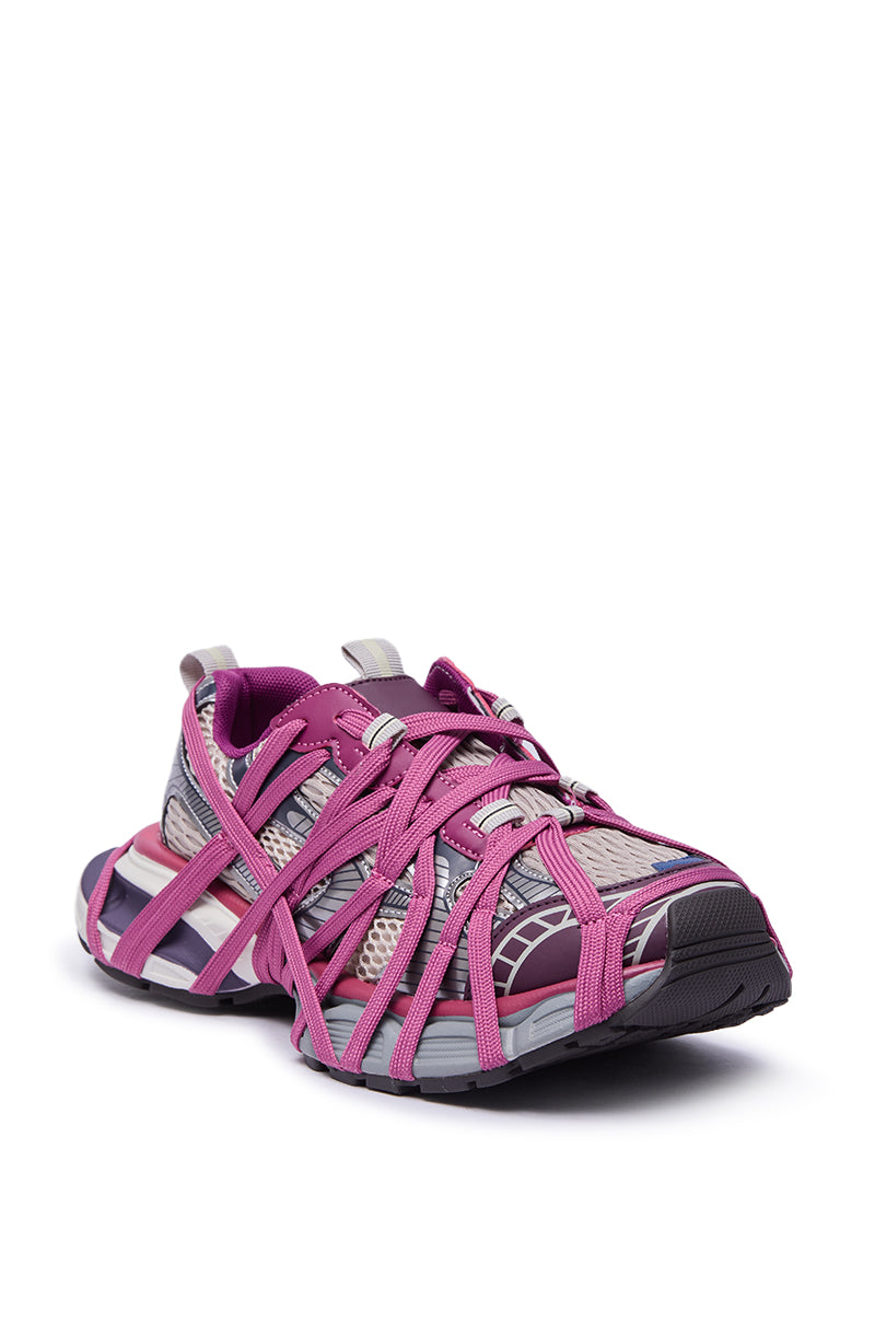 The AZALEA WANG SELIE PURPLE LACE UP SNEAKER features a platform sole, gray mesh base, bright pink crisscross straps, a pink inner lining, and gray-and-white accents, displayed at an angle on a white background.