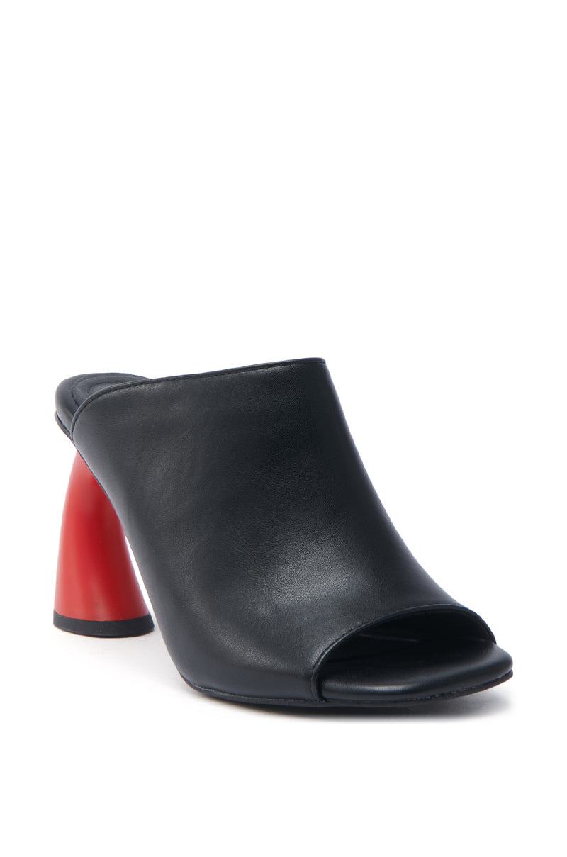 The AZALEA WANG SIDLE mule is a chic black slip-on made from faux leather, with an open toe and a bold red cylindrical block heel, elegantly displayed on a white backdrop.