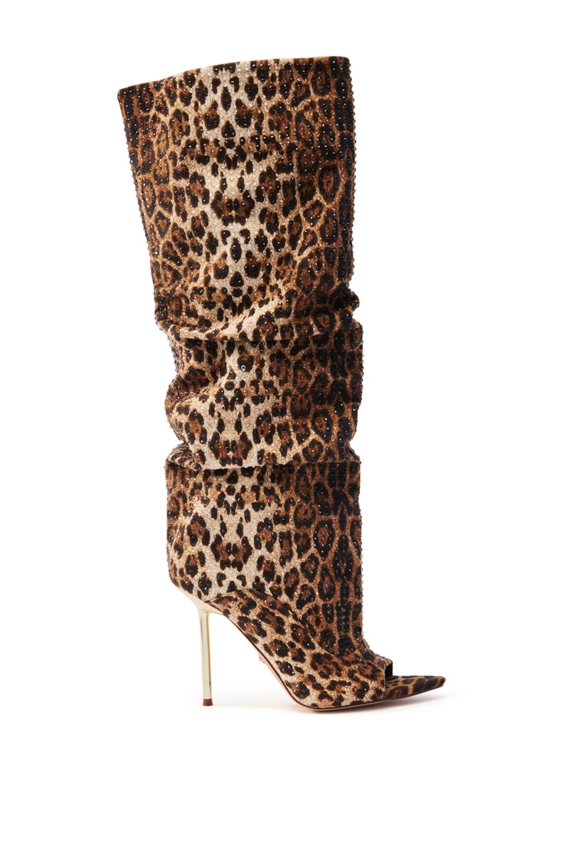 The AZALEA WANG SPHYNX LEOPARD OPEN TOE BOOT is a faux suede slouchy design with a sleek stiletto heel, set against a white background.