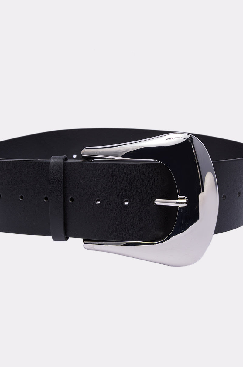The BIGGER IS ALWAYS BETTER BELT, featuring black faux leather and a large shiny silver buckle, is shown against a plain white background.