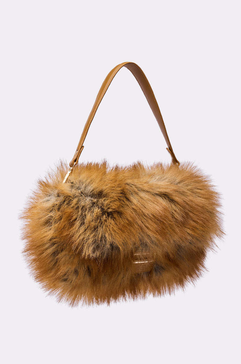 The REALLY LIKE THAT FAUX FUR PURSE showcases a brown leather strap and a fluffy faux fox fur body in brown and black tones, displayed on a plain light background.