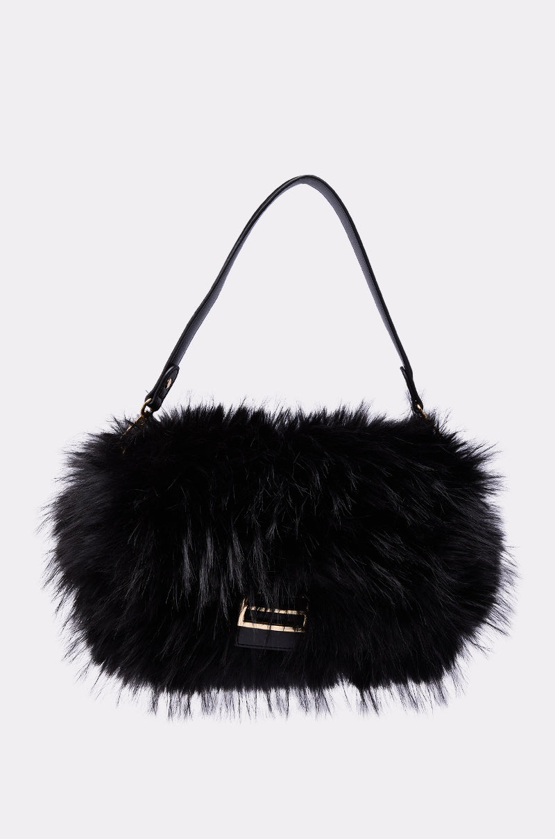 The REALLY LIKE THAT FAUX FUR PURSE IN BLACK features a chic black faux fur design, a short black strap, and a gold clasp, shown against a plain light background.