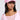 A person confidently poses in a PRETTY IN PINK BRIM HAT and sheer pink top, accessorized with large sunglasses, hoop earrings, and a chain necklace. The style is casually trendy against a neutral background.