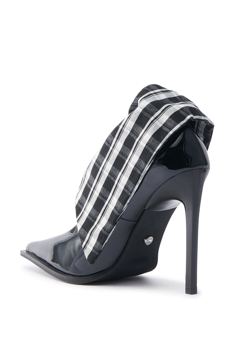 The AZALEA WANG TLALLI BLACK COLLARED PUMP STILETTO features a unique folded top design in glossy patent faux leather with a sophisticated black and white plaid pattern, pointed toe, and slender high heel for an elegant touch.