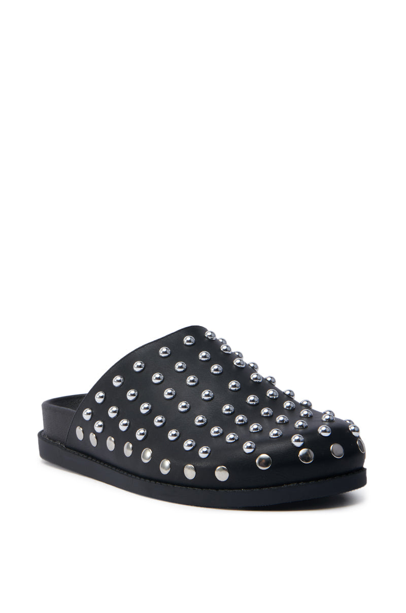 The AZALEA WANG TRAVERSE BLACK CLOG is a black slip-on faux leather shoe with a flat sole, covered in silver metallic studs for a textured, edgy appearance. Designed for both style and comfort, it includes a cushioned footbed for all-day wear.