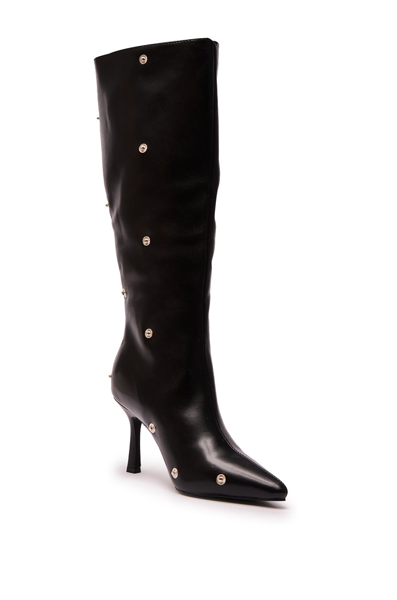The AZALEA WANG VULTURE BLACK SHERPA LINED BOOT is a tall, black faux leather knee-high boot featuring a pointed toe and silver stud accents scattered across the shaft and foot.