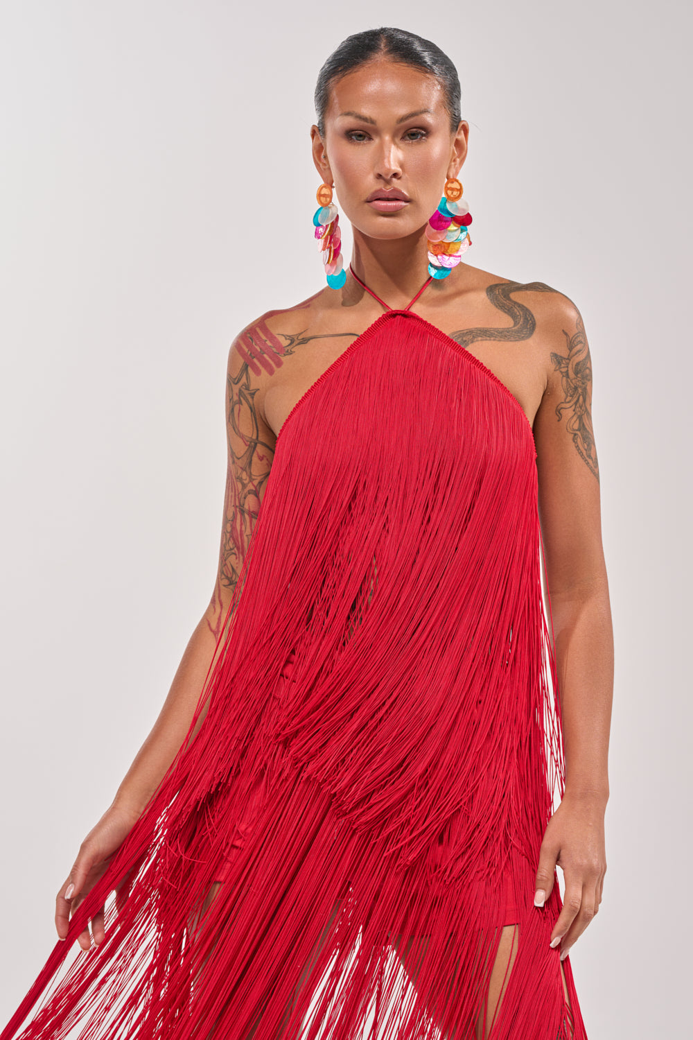 ON THE EDGE FRINGE HALTER TOP – AKIRA