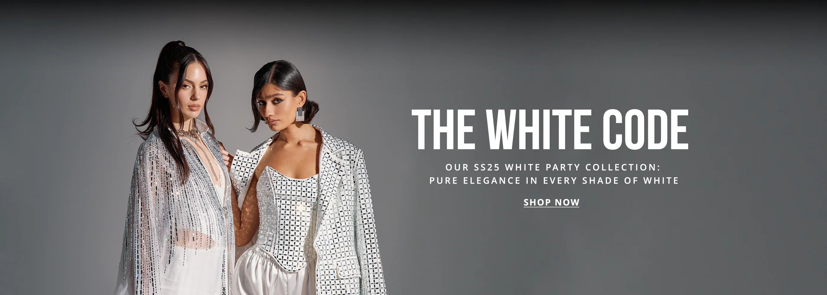 Two women in stylish white outfits pose against a gray background. Text reads: "THE WHITE CODE. Our SS25 White Party Collection: Pure elegance in every shade of white. Shop Now.