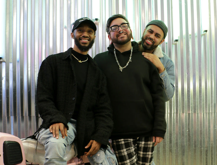 Three AKIRA store managers posing for a picture