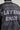 A detailed view of the PLAYERS ONLY JERSEY BOMBER, designed in a black and white textured style, showcasing 