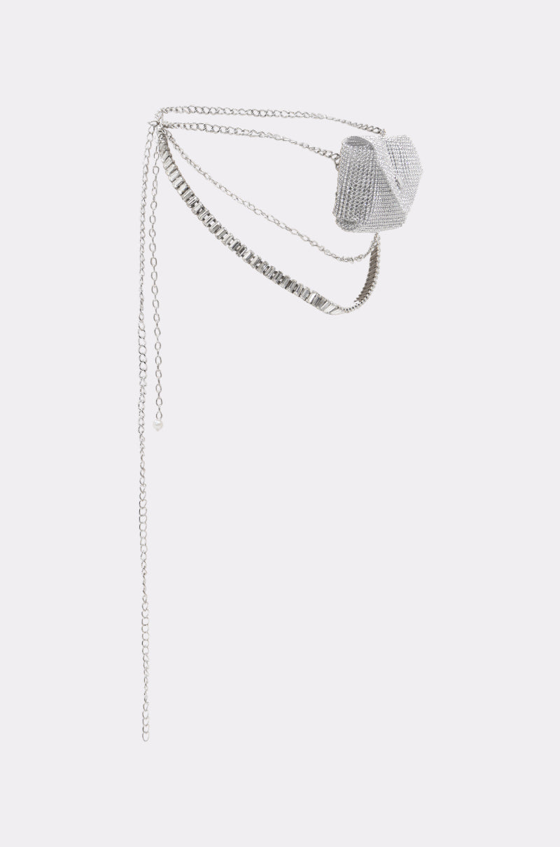 The IN MY BAG BLING CHAIN BELT is a small, silver heart-shaped mini bag with rhinestones, crystal embellishments, and a long chain strap—perfect as a statement festival accessory against a simple light background.
