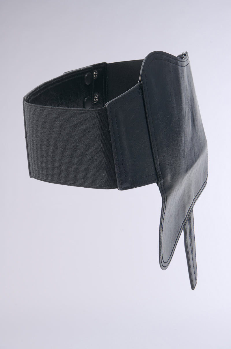 The DIDI LOVES ME PU POUCH BELT is a wide black belt with a structured, asymmetrical faux leather pouch and an elastic band, shown on a plain light gray background.